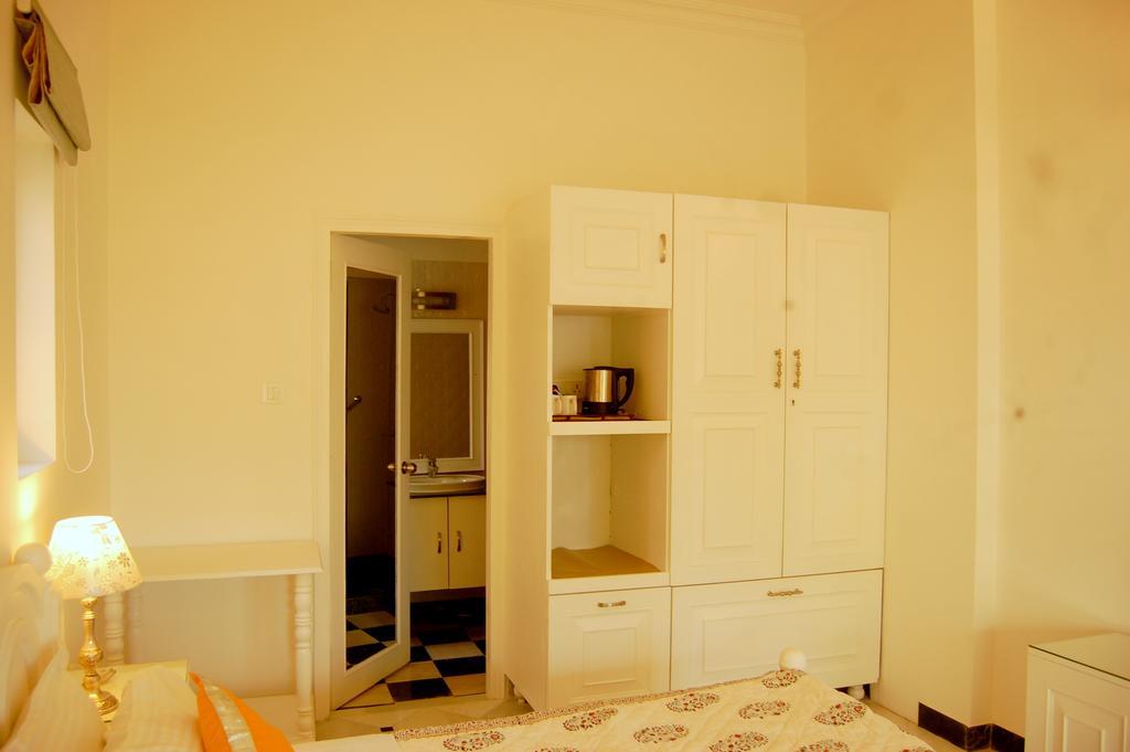 Aashray Apartman Váránaszi Szoba fotó